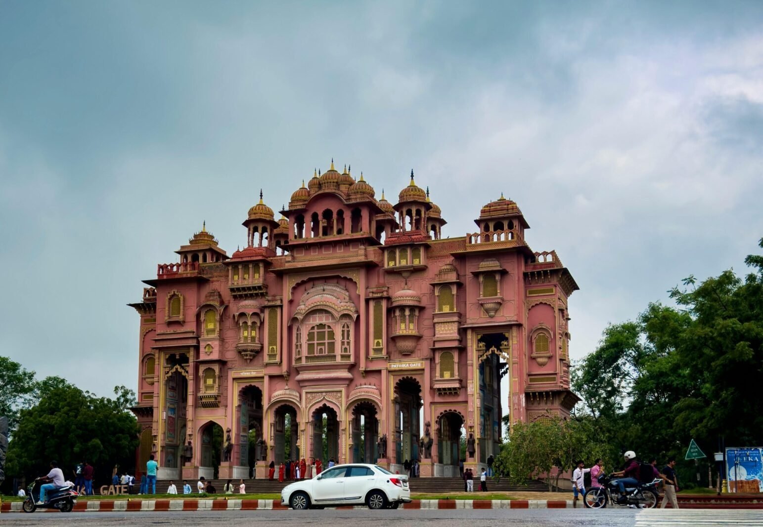 Patrika Gate in Jaipur, a grand pink structure with domes and arches, showcasing Rajasthani architecture. Patrika Gate in Jaipur, a grand pink structure with domes and arches, showcasing Rajasthani architecture.