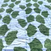 Green Leaf Kantha Quilt on Bed – Handmade Cotton Block Print Bedspread by OmraDecor