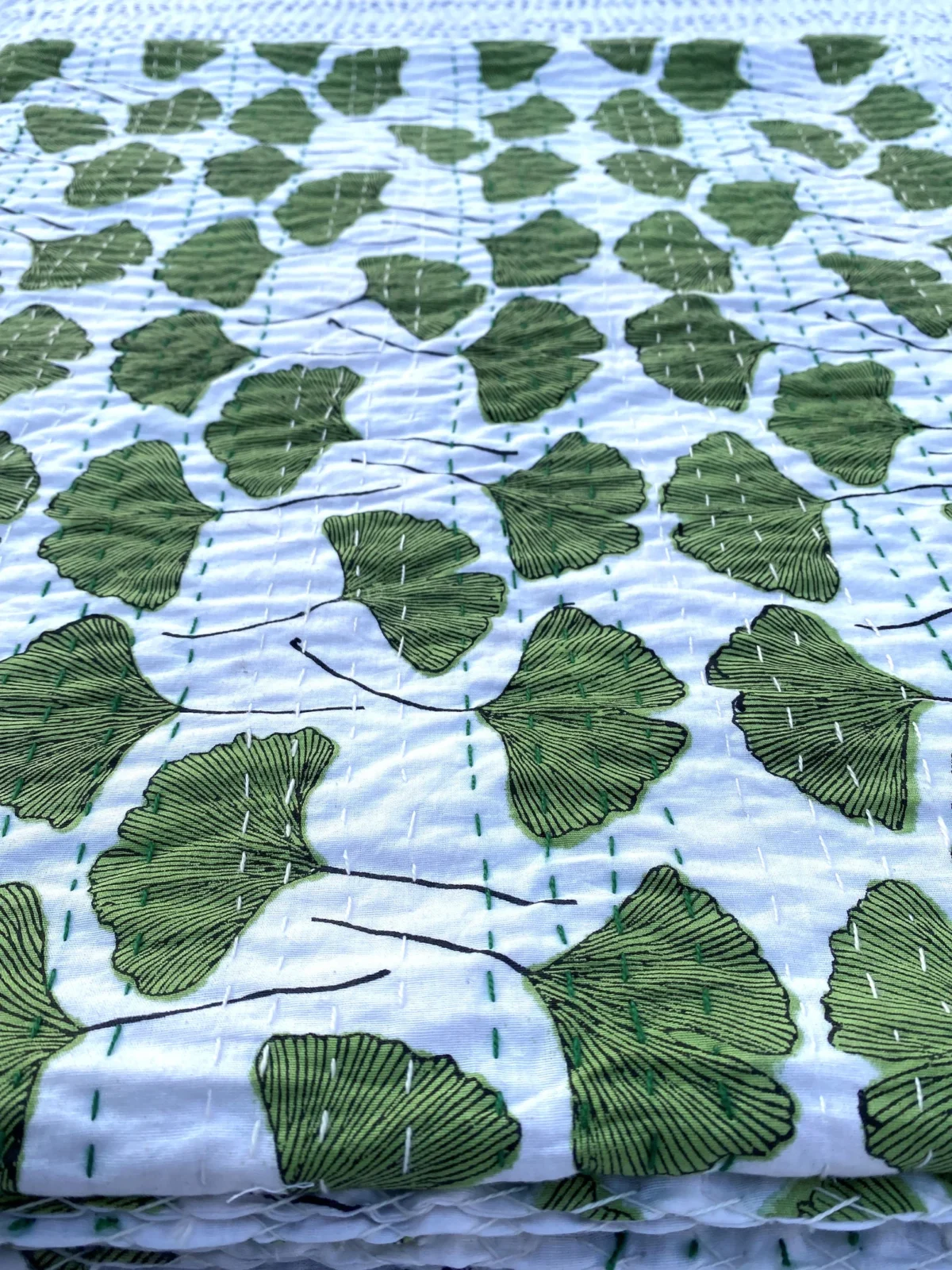 Green Leaf Kantha Quilt on Bed – Handmade Cotton Block Print Bedspread by OmraDecor
