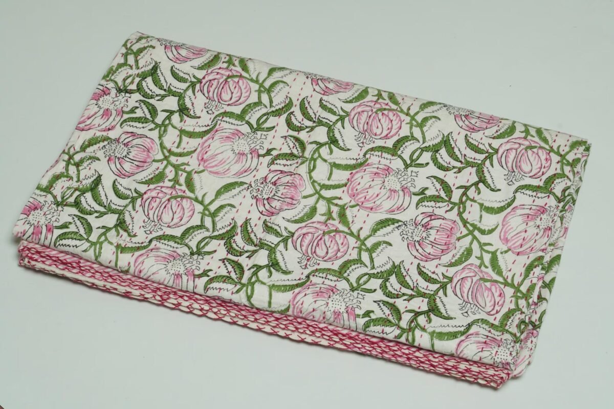 Handmade pink floral block print Kantha quilt on white cotton fabric