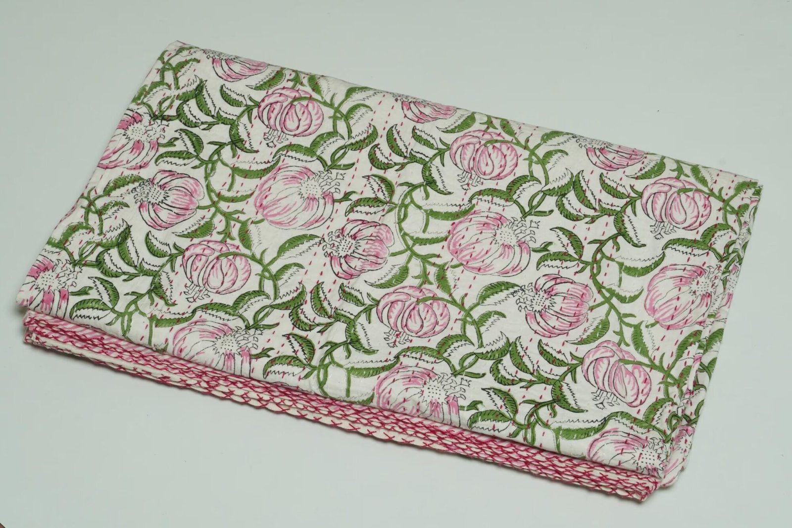 Handmade pink floral block print Kantha quilt on white cotton fabric