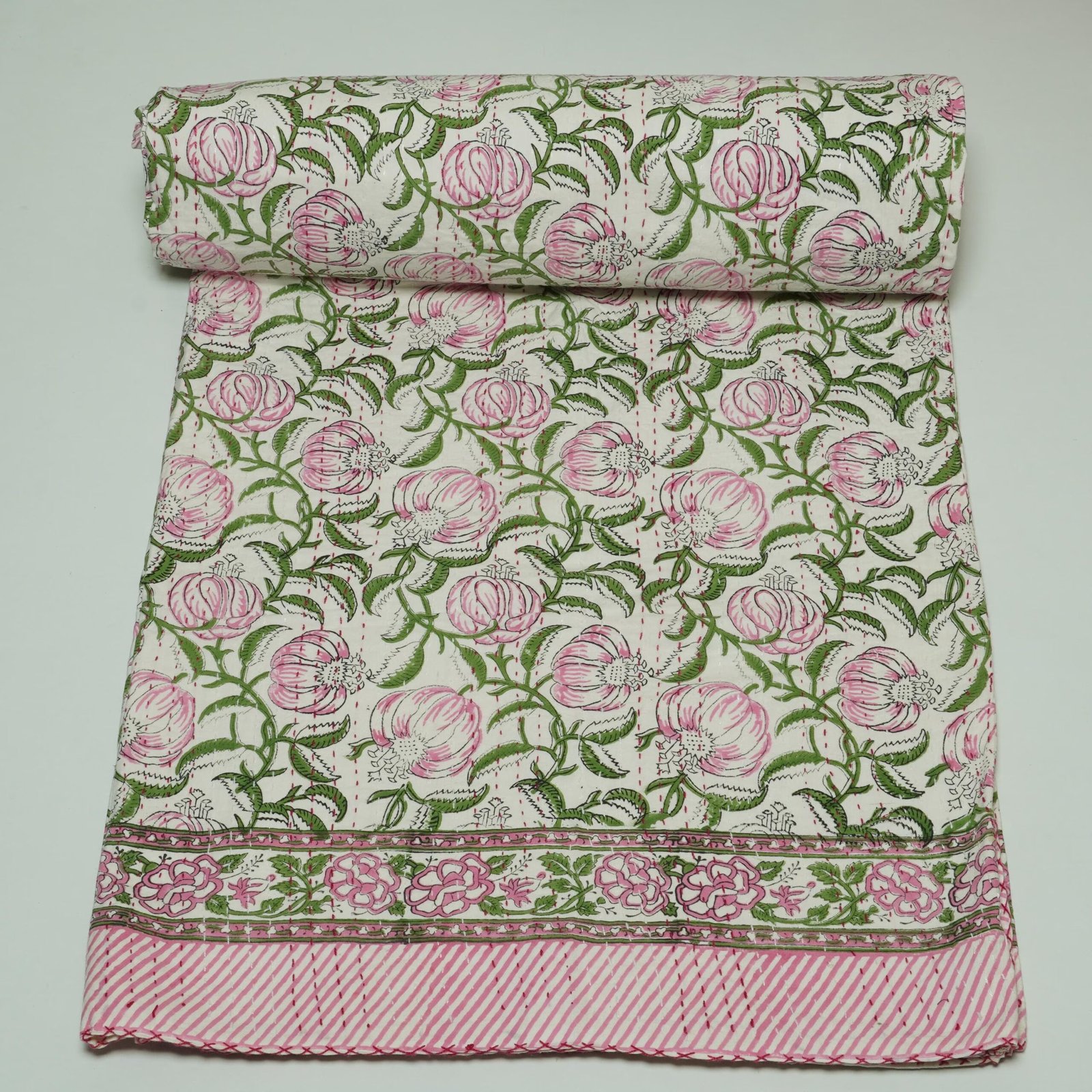 Handmade pink floral block print Kantha quilt on white cotton fabric
