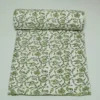 “Handmade green floral block print Kantha quilt on white cotton fabric with hand stitching”