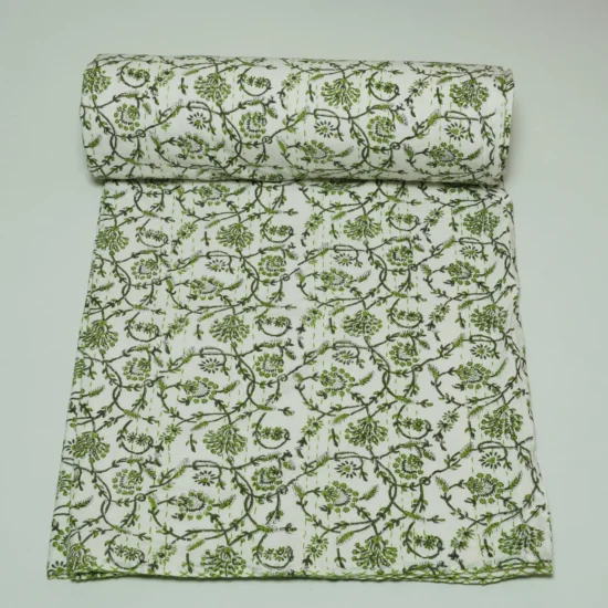 “Handmade green floral block print Kantha quilt on white cotton fabric with hand stitching”