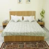 “Handmade green floral block print Kantha quilt on white cotton fabric with hand stitching”