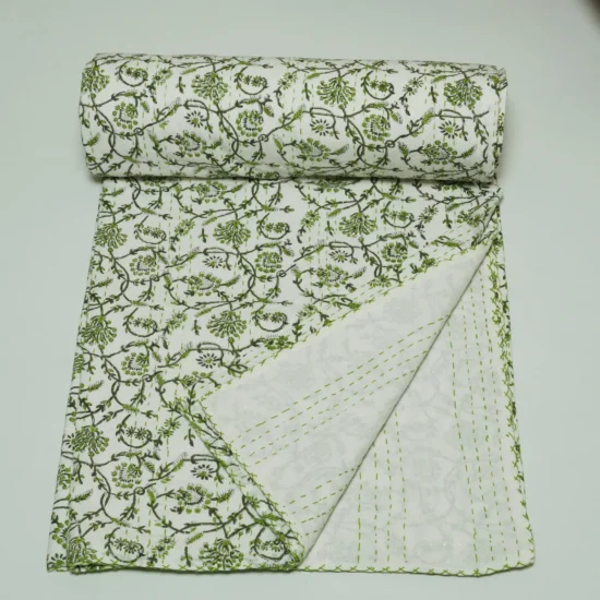 “Handmade green floral block print Kantha quilt on white cotton fabric with hand stitching”
