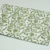 “Handmade green floral block print Kantha quilt on white cotton fabric with hand stitching”