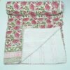 Handmade pink floral block print Kantha quilt in pure cotton with green vine design and traditional Indian stitching