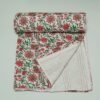 White floral block print Kantha quilt made from pure cotton, featuring red floral patterns with green leaves, handmade and reversible bedspread