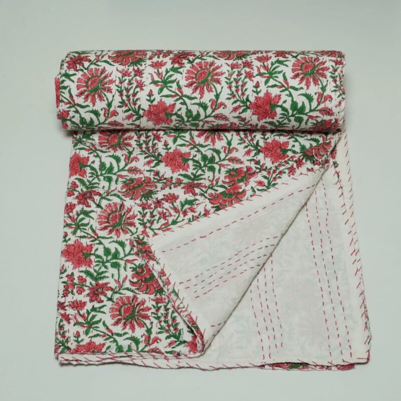 White floral block print Kantha quilt made from pure cotton, featuring red floral patterns with green leaves, handmade and reversible bedspread