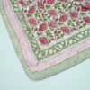 Handmade pink floral block print Kantha quilt in pure cotton with green vine design and traditional Indian stitching