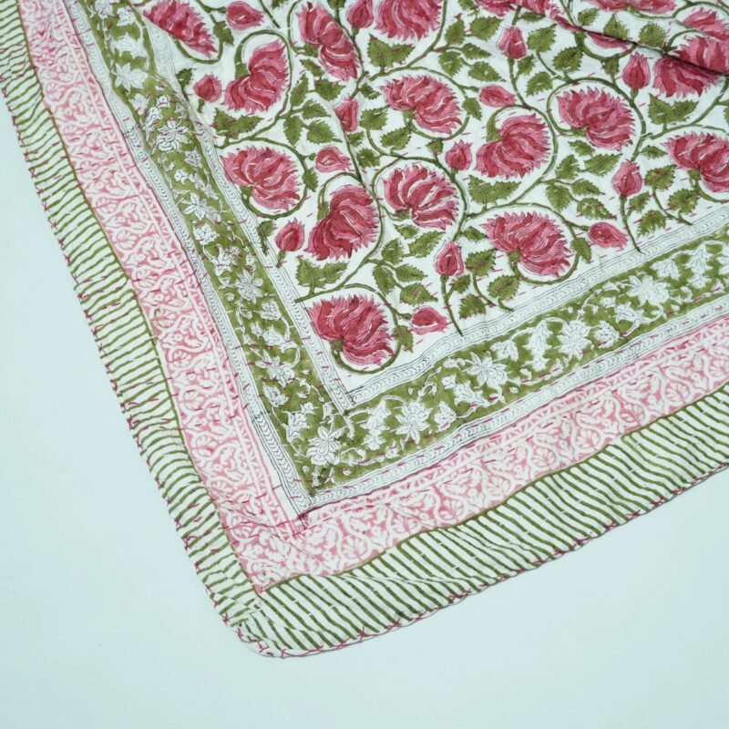 Handmade pink floral block print Kantha quilt in pure cotton with green vine design and traditional Indian stitching