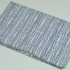 Rolled blue block print Kantha cotton fabric with geometric leaf pattern on white base by omradecor