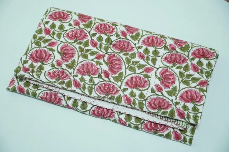 Handmade pink floral block print Kantha quilt in pure cotton with green vine design and traditional Indian stitching