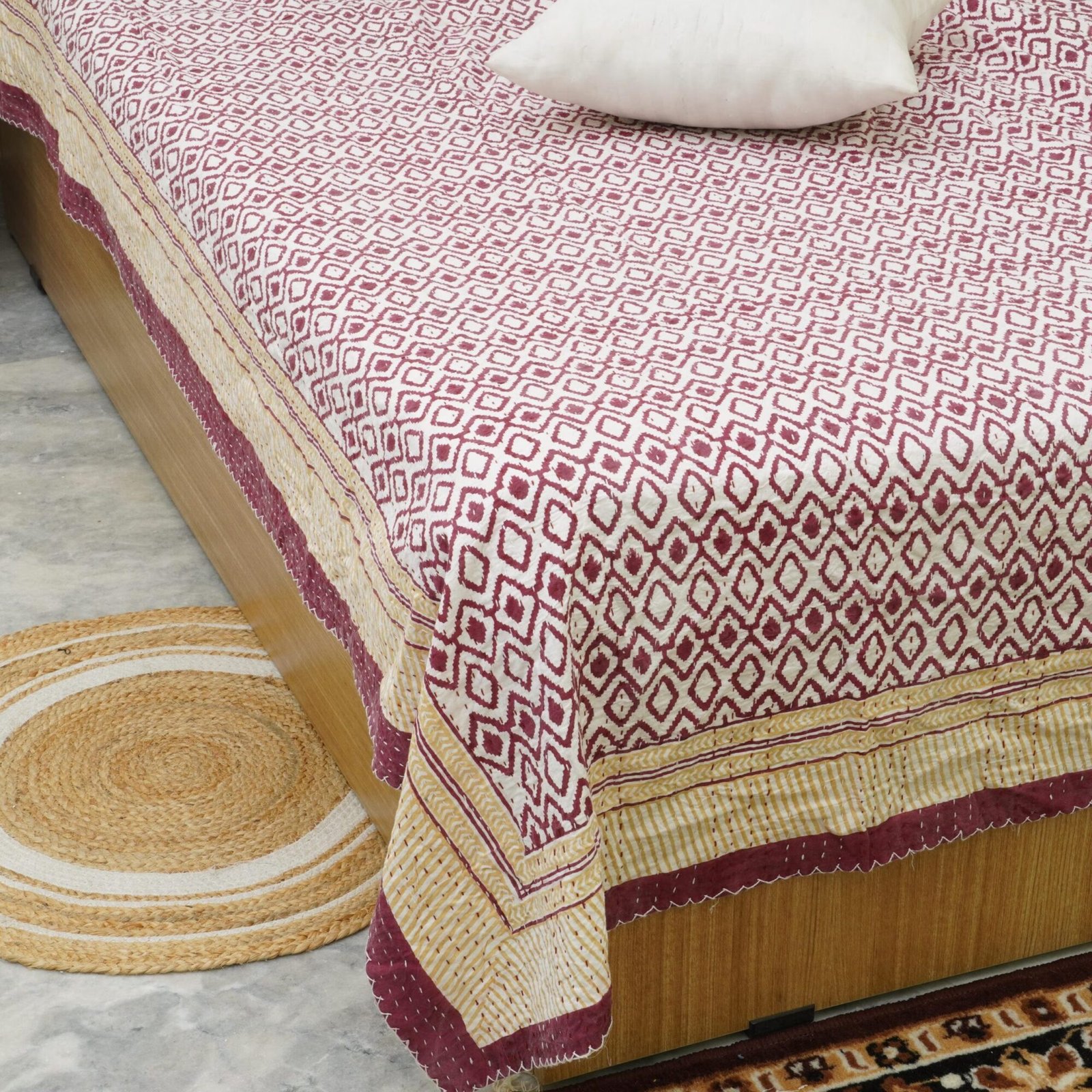 Maroon geometric block print Kantha quilt with mustard border, handmade cotton bedspread from Jaipur.