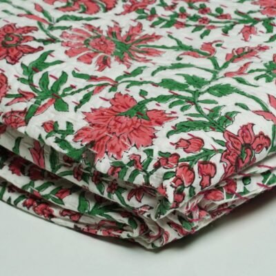White floral block print Kantha quilt made from pure cotton, featuring red floral patterns with green leaves, handmade and reversible bedspread