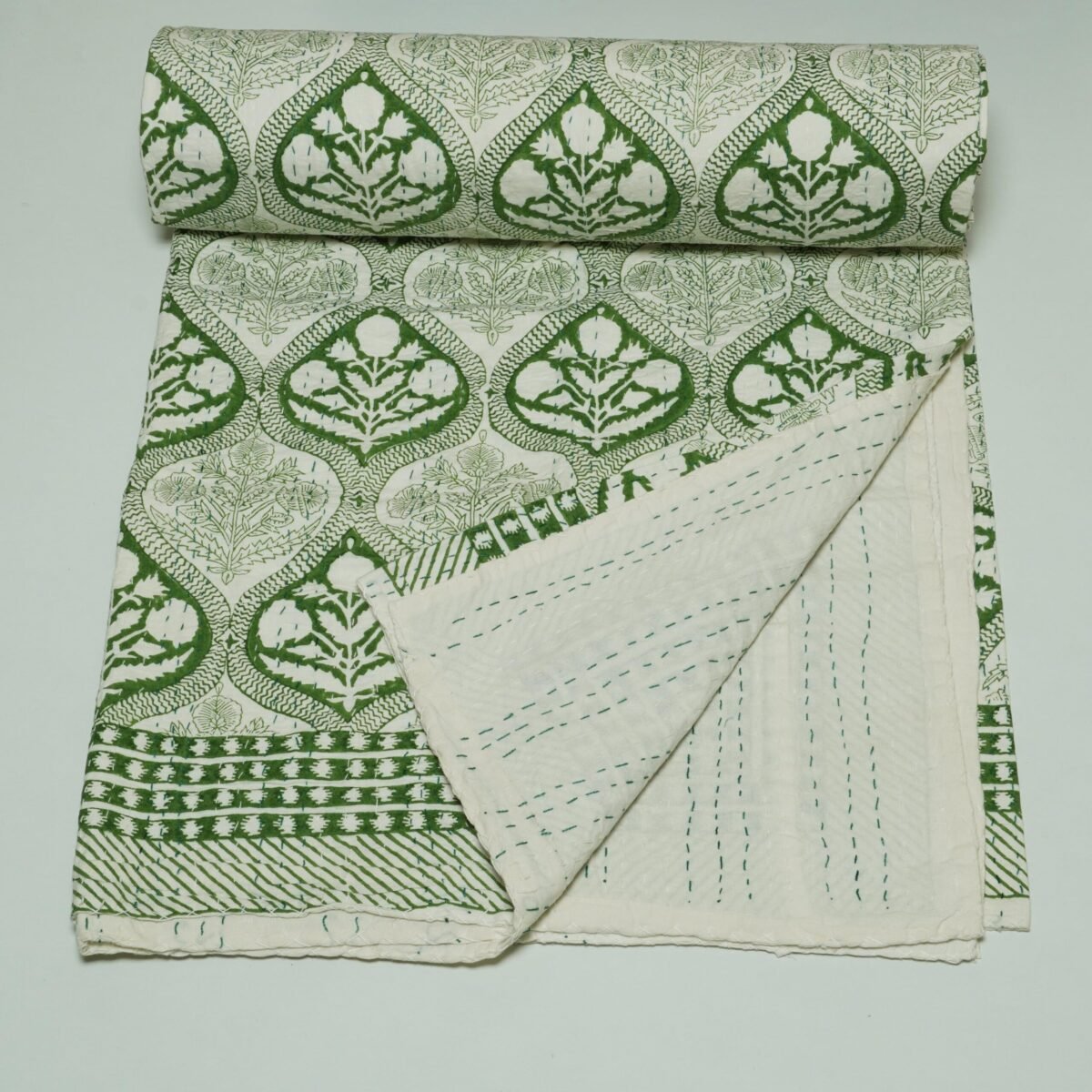 Rolled green floral paisley block print Kantha cotton fabric with handcrafted stitching on a cream base, by omradecor