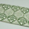 Rolled green floral paisley block print Kantha cotton fabric with handcrafted stitching on a cream base, by omradecor