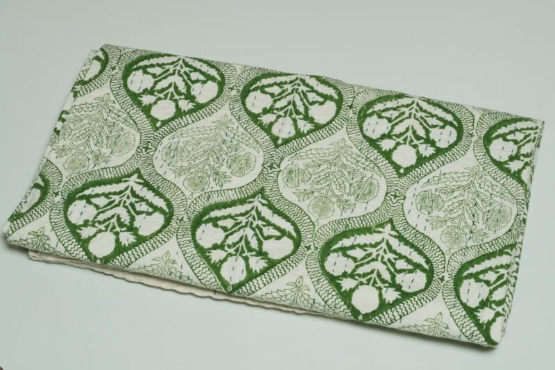 Rolled green floral paisley block print Kantha cotton fabric with handcrafted stitching on a cream base, by omradecor