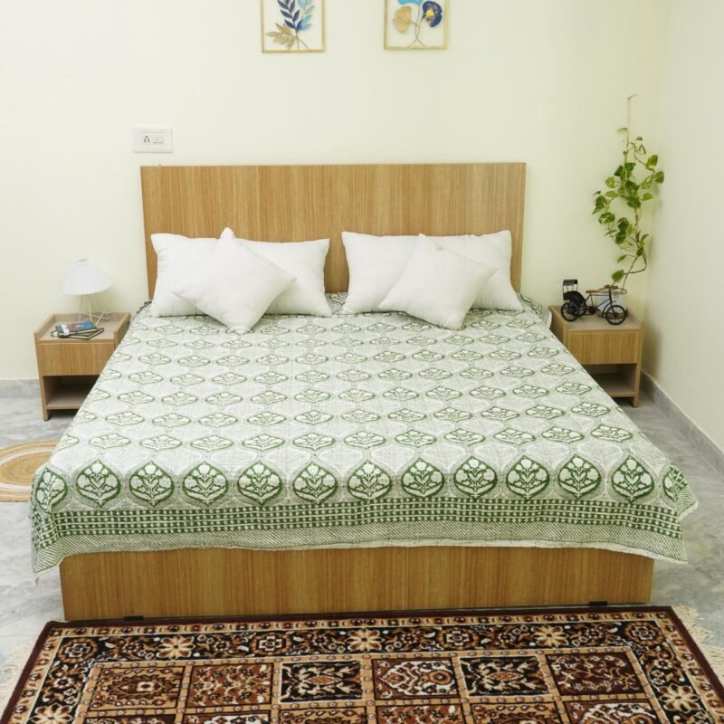 Rolled green floral paisley block print Kantha cotton fabric with handcrafted stitching on a cream base, by omradecor